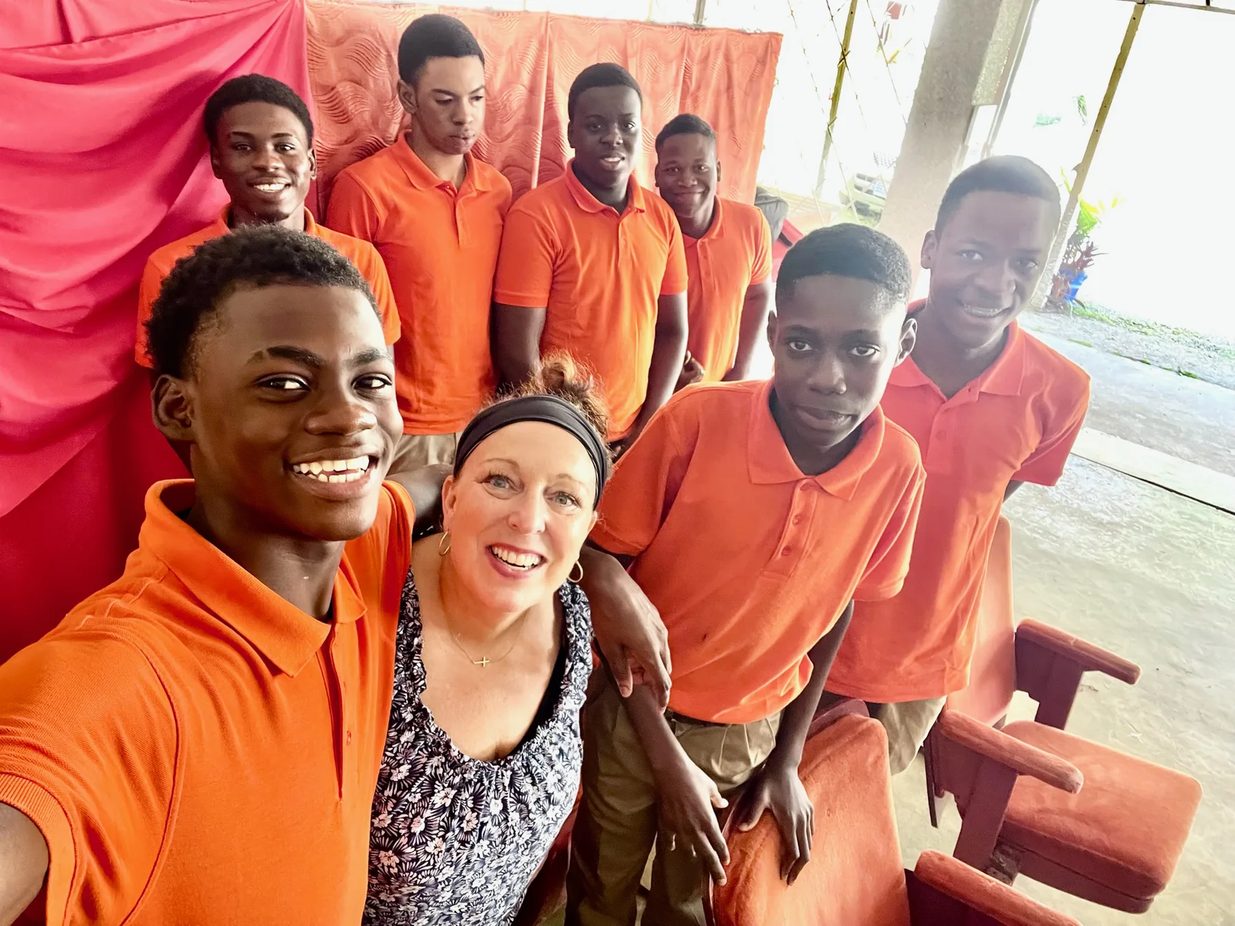 Kat Weir with boys participating in youth mentorship in Jamaica